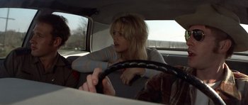 Movie still from “The Sugarland Express” (1974), directed by Steven Spielberg – A woman sitting in the driver's seat of a car; Close Up shot, Over the shoulder angle