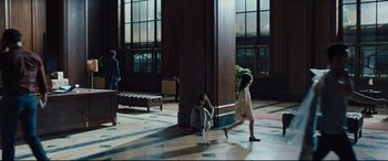 Movie still from “The Super” (2017), directed by Stephan Rick – A woman sitting on the ground next to a child; Wide shot, High angle