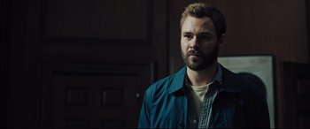 Movie still from “The Super” (2017), directed by Stephan Rick – A person wearing a jacket; Close Up shot, Over the shoulder angle