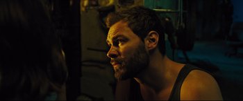 Movie still from “The Super” (2017), directed by Stephan Rick – A person with a beard; Close Up shot, Over the shoulder angle