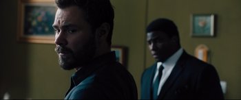 Movie still from “The Super” (2017), directed by Stephan Rick – Two men standing next to each other in a room; Close Up shot, Over the shoulder angle