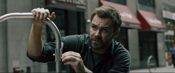 Movie still from “The Super” (2017), directed by Stephan Rick – A person leaning on a rail; Close Up shot, Low angle