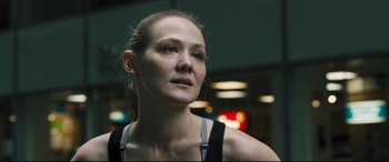 Movie still from “The Super” (2017), directed by Stephan Rick – A person wearing a tank top; Close Up shot, Low angle