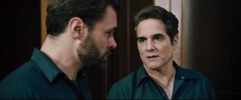 Movie still from “The Super” (2017), directed by Stephan Rick – Two men are looking at each other in a mirror; Close Up shot, Over the shoulder angle