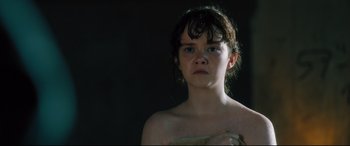 Movie still from “The Super” (2017), directed by Stephan Rick – A young girl with wet hair is looking at the camera; Close Up shot, High angle