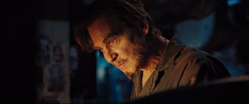 Movie still from “The Super” (2017), directed by Stephan Rick – A person wearing a necklace; Close Up shot, Low angle