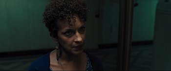 Movie still from “The Super” (2017), directed by Stephan Rick – A person wearing a necklace; Close Up shot, Over the shoulder angle