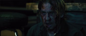 Movie still from “The Super” (2017), directed by Stephan Rick – A person with blood on his face; Close Up shot, Over the shoulder angle