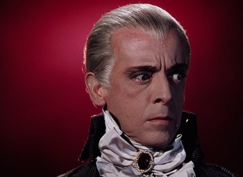 Movie still from “The Tales of Hoffmann” (1951), directed by Michael Powell – A person wearing a costume; Close Up shot, Low angle