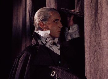 Movie still from “The Tales of Hoffmann” (1951), directed by Michael Powell – A wax figure of a man dressed as a vampire; Medium shot, Low angle