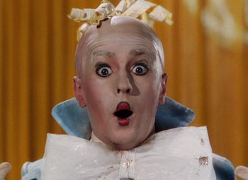 Movie still from “The Tales of Hoffmann” (1951), directed by Michael Powell – A person wearing a clown costume; Close Up shot, Low angle