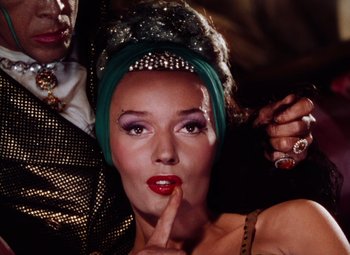 Movie still from “The Tales of Hoffmann” (1951), directed by Michael Powell – A person wearing a headpiece; Close Up shot, Low angle