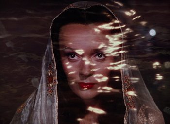 Movie still from “The Tales of Hoffmann” (1951), directed by Michael Powell – A woman with a veil over her head and face; Close Up shot, Overhead angle