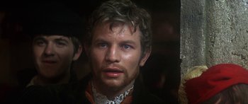 Movie still from “The Taming of The Shrew” (1967), directed by Franco Zeffirelli – A person with a beard; Close Up shot, Over the shoulder angle