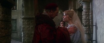 Movie still from “The Taming of The Shrew” (1967), directed by Franco Zeffirelli – A man and a woman in medieval garb; Medium shot, Over the shoulder angle