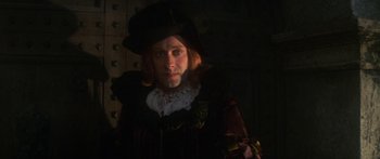 Movie still from “The Taming of The Shrew” (1967), directed by Franco Zeffirelli – A man dressed in renaissance clothing in a dimly - lit room; Close Up shot, Low angle