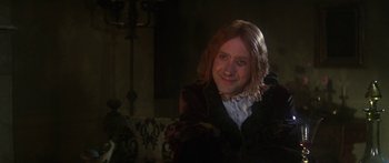 Movie still from “The Taming of The Shrew” (1967), directed by Franco Zeffirelli – A man with long red hair wearing a wig; Close Up shot, Over the shoulder angle