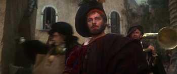 Movie still from “The Taming of The Shrew” (1967), directed by Franco Zeffirelli – A person wearing a hat; Close Up shot, Over the shoulder angle