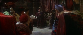 Movie still from “The Taming of The Shrew” (1967), directed by Franco Zeffirelli – A group of people standing in a room; Wide shot, Over the shoulder angle