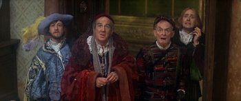 Movie still from “The Taming of The Shrew” (1967), directed by Franco Zeffirelli – Two men dressed in medieval clothing , one of which is holding a sword; Medium shot, High angle