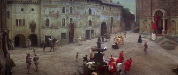 Movie still from “The Taming of The Shrew” (1967), directed by Franco Zeffirelli – A group of people dressed in medieval clothing; Extreme Wide shot, High angle
