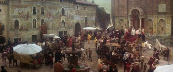 Movie still from “The Taming of The Shrew” (1967), directed by Franco Zeffirelli – A crowd of people walking on a street; Extreme Wide shot, High angle