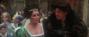 Movie still from “The Taming of The Shrew” (1967), directed by Franco Zeffirelli – A man and a woman dressed in medieval clothing; Close Up shot, Over the shoulder angle