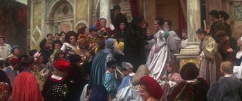 Movie still from “The Taming of The Shrew” (1967), directed by Franco Zeffirelli – A group of people dressed in medieval costumes; Wide shot, High angle