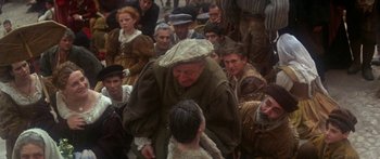 Movie still from “The Taming of The Shrew” (1967), directed by Franco Zeffirelli – An old man and a young boy in a crowd of people; Medium shot, High angle