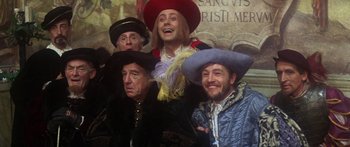 Movie still from “The Taming of The Shrew” (1967), directed by Franco Zeffirelli – A group of men in medieval garb posing for a picture; Medium shot, Low angle
