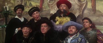 Movie still from “The Taming of The Shrew” (1967), directed by Franco Zeffirelli – A group of people wearing hats and posing for a picture; Medium shot, Low angle