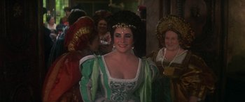 Movie still from “The Taming of The Shrew” (1967), directed by Franco Zeffirelli – A group of women dressed up in renaissance costumes; Medium shot, Over the shoulder angle