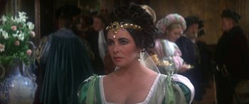 Movie still from “The Taming of The Shrew” (1967), directed by Franco Zeffirelli – A person wearing a costume; Close Up shot, Over the shoulder angle