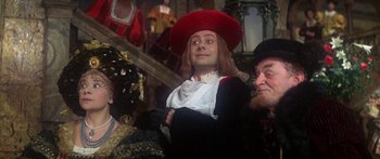 Movie still from “The Taming of The Shrew” (1967), directed by Franco Zeffirelli – A man in a red hat and a white shirt; Medium shot, Low angle
