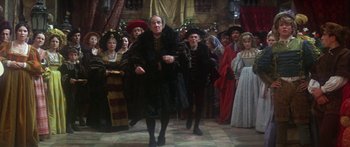 Movie still from “The Taming of The Shrew” (1967), directed by Franco Zeffirelli – A group of people dressed in medieval clothing; Wide shot, High angle