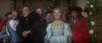 Movie still from “The Taming of The Shrew” (1967), directed by Franco Zeffirelli – A group of people standing next to each other; Medium shot, Low angle