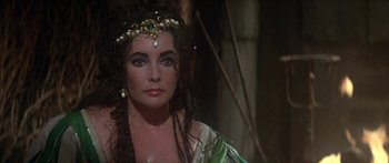 Movie still from “The Taming of The Shrew” (1967), directed by Franco Zeffirelli – A person wearing a costume; Close Up shot, Over the shoulder angle