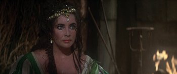 Movie still from “The Taming of The Shrew” (1967), directed by Franco Zeffirelli – A person wearing a costume; Close Up shot, Over the shoulder angle