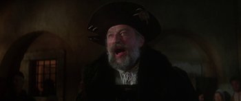 Movie still from “The Taming of The Shrew” (1967), directed by Franco Zeffirelli – An old man with a beard wearing a pirate hat; Close Up shot, Low angle