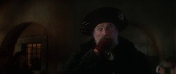 Movie still from “The Taming of The Shrew” (1967), directed by Franco Zeffirelli – An old man with a beard wearing a black hat; Close Up shot, Low angle