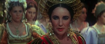 Movie still from “The Taming of The Shrew” (1967), directed by Franco Zeffirelli – A person wearing a costume; Close Up shot, Over the shoulder angle