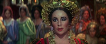 Movie still from “The Taming of The Shrew” (1967), directed by Franco Zeffirelli – A person wearing a hat; Close Up shot, Over the shoulder angle