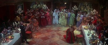 Movie still from “The Taming of The Shrew” (1967), directed by Franco Zeffirelli – A group of people dressed in medieval costumes; Extreme Wide shot, High angle