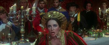 Movie still from “The Taming of The Shrew” (1967), directed by Franco Zeffirelli – A group of people dressed in renaissance clothing; Close Up shot, Over the shoulder angle