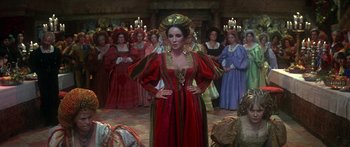 Movie still from “The Taming of The Shrew” (1967), directed by Franco Zeffirelli – A group of people dressed in medieval costumes; Wide shot, High angle