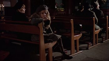 Movie still from “The Tenant” (1976), directed by Roman Polanski – A little girl sitting on a wooden bench; Wide shot, High angle