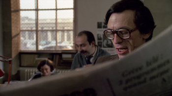 Movie still from “The Tenant” (1976), directed by Roman Polanski – A man and a woman are reading a newspaper together; Close Up shot, Low angle