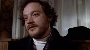 Movie still from “The Tenant” (1976), directed by Roman Polanski – A person with a beard; Close Up shot, Low angle