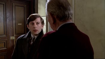 Movie still from “The Tenant” (1976), directed by Roman Polanski – An older man looking at himself in the mirror; Close Up shot, Over the shoulder angle