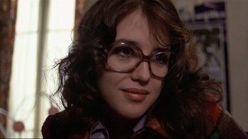 Movie still from “The Tenant” (1976), directed by Roman Polanski – A person wearing glasses; Close Up shot, Over the shoulder angle